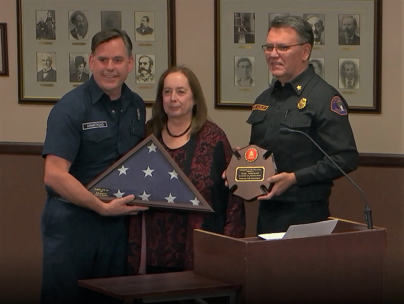 Tumwater Fire Chief Brian Hurley and Mayor Debbie Sullivan awarded fire prevention officer Mark Armstrong (left) with a plaque recognizing him as 2022’s Firefighter of the Year.
